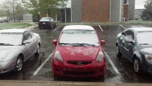 Snow falling on my sister's car in Kansas...on May 2nd.